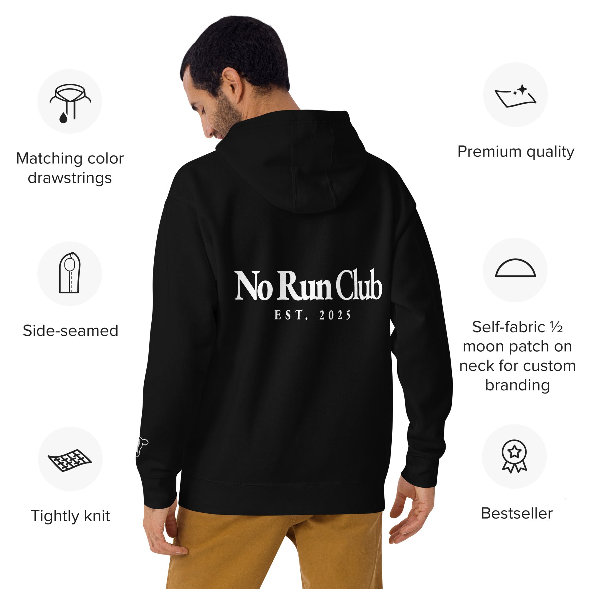 Black hoodie with branding on the back, displayed on a man, with product features listed.