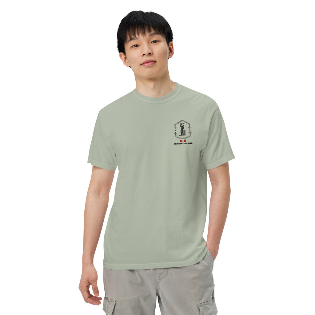 Person wearing a light green t-shirt and cargo pants on a white background