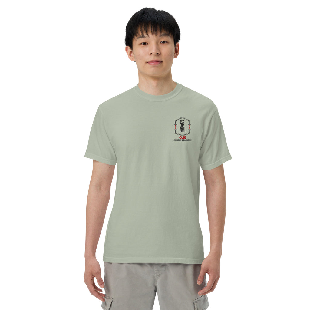 Person wearing a light green t-shirt with a black logo on a white background