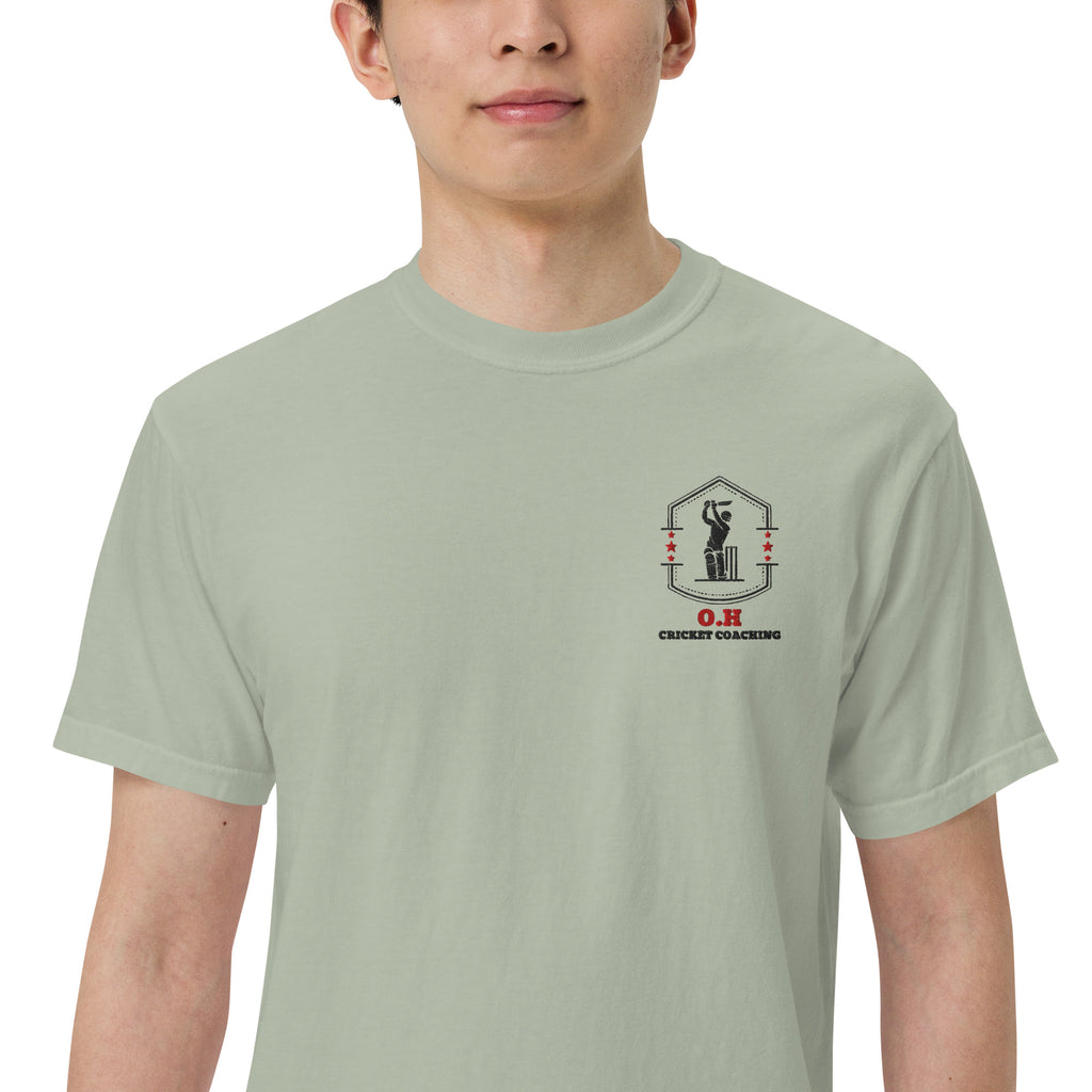 Person wearing a light green t-shirt with a logo and text on a white background