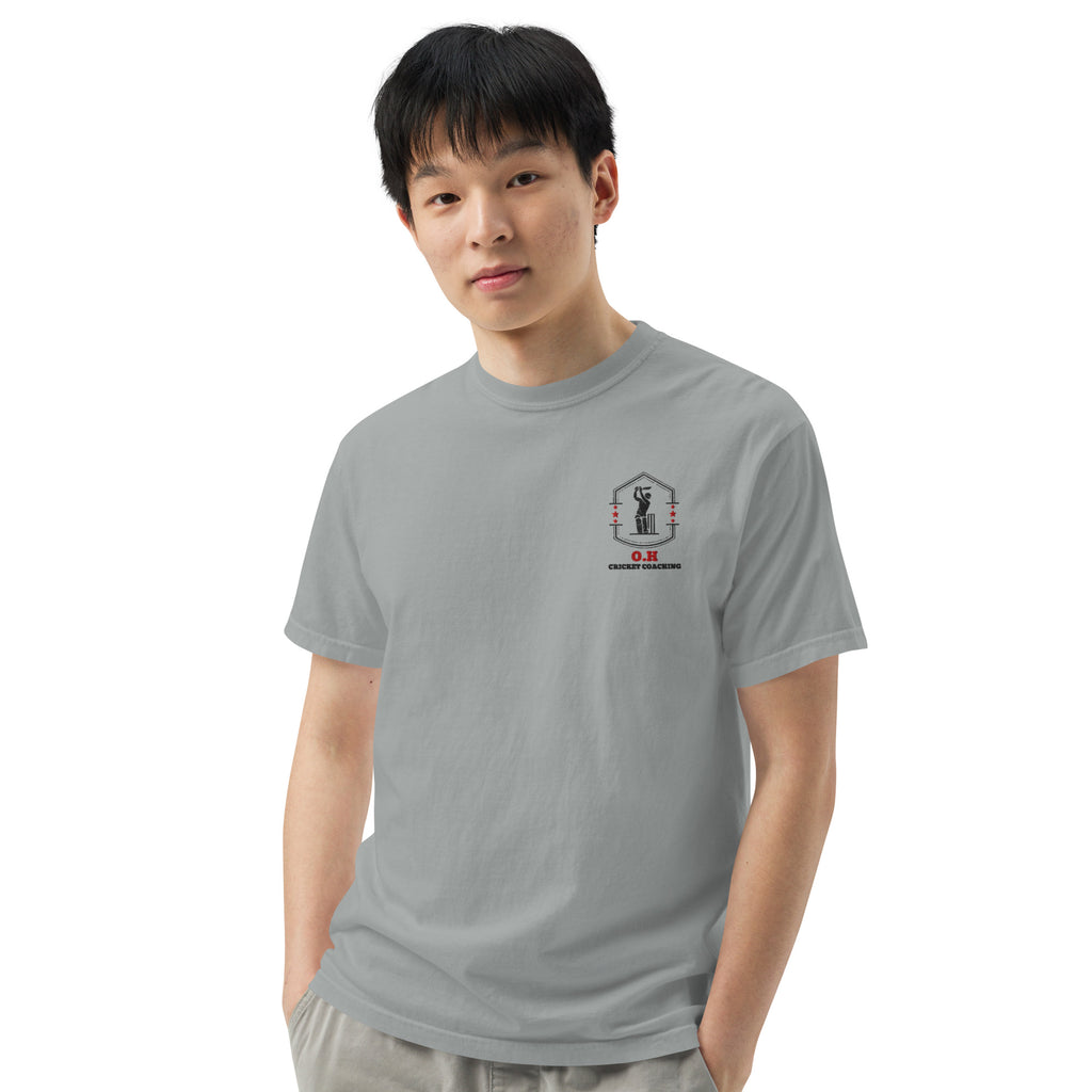 Person wearing a gray t-shirt with a graphic design on a white background