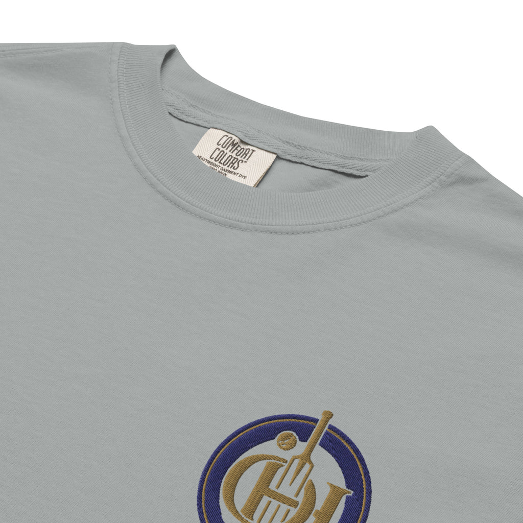 Close-up of a light gray crewneck t-shirt and blue circular graphic on the lower left chest.
