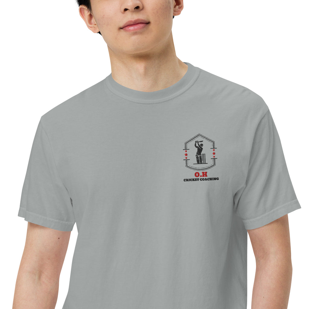 Person wearing a gray t-shirt with a logo on a white background