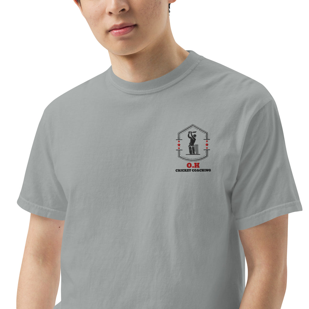 Person wearing a gray t-shirt with a logo and text on a white background