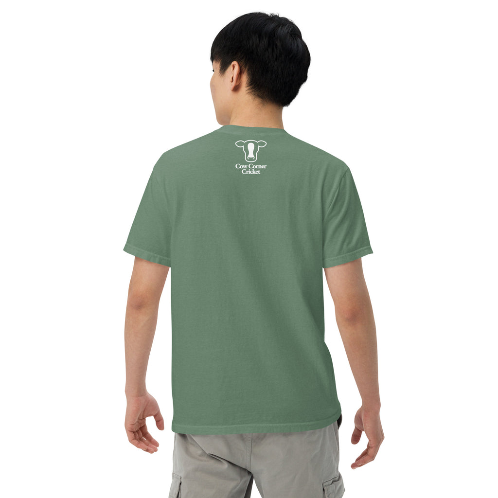 Person wearing a green t-shirt with a graphic design and text on a white background