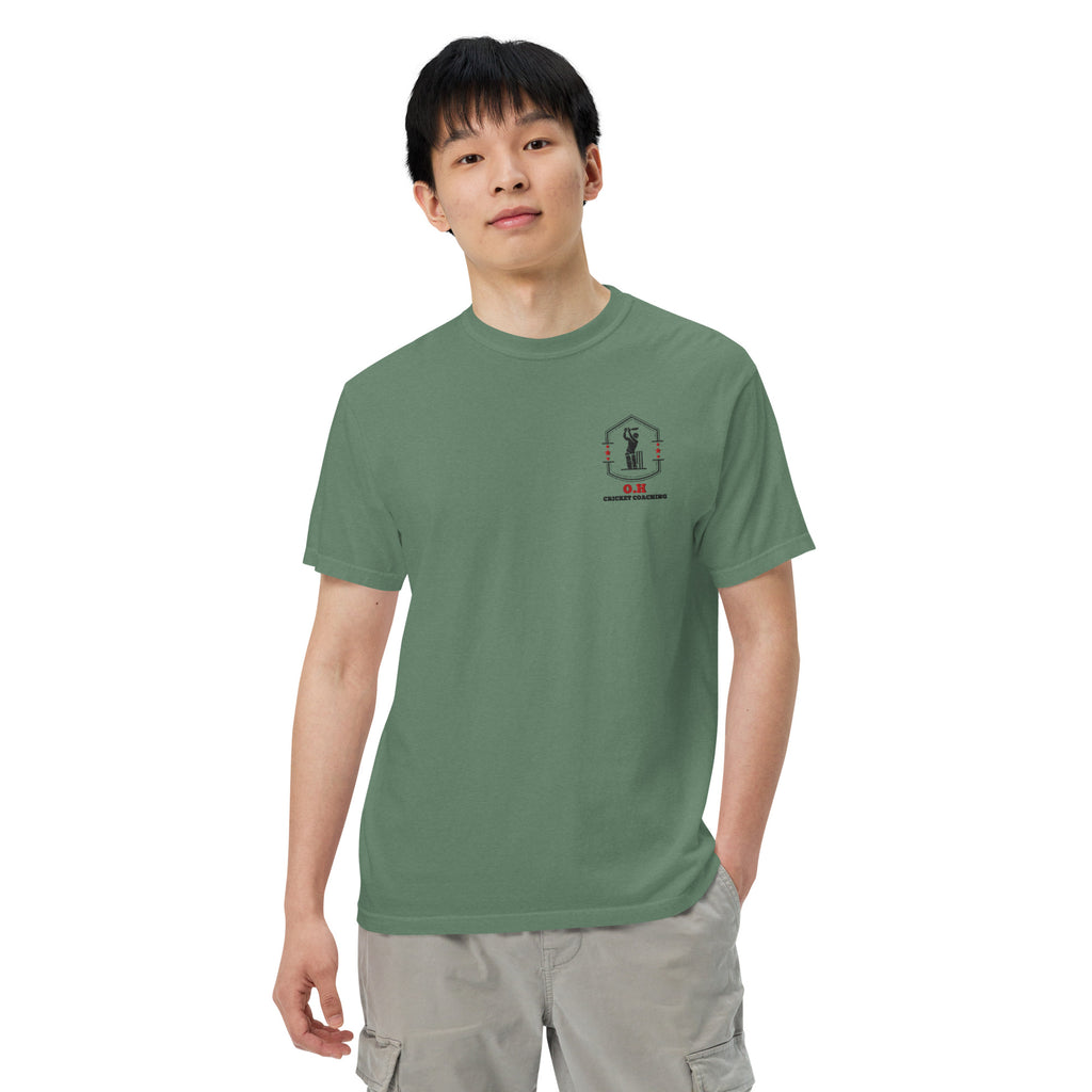 Person wearing a green t-shirt with a logo on a white background