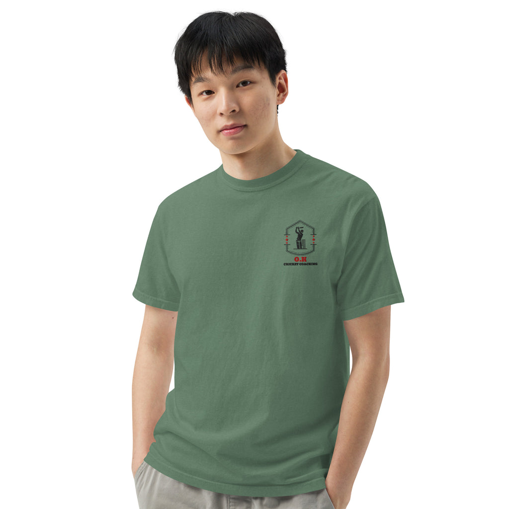 Person wearing a green t-shirt with a logo on a white background