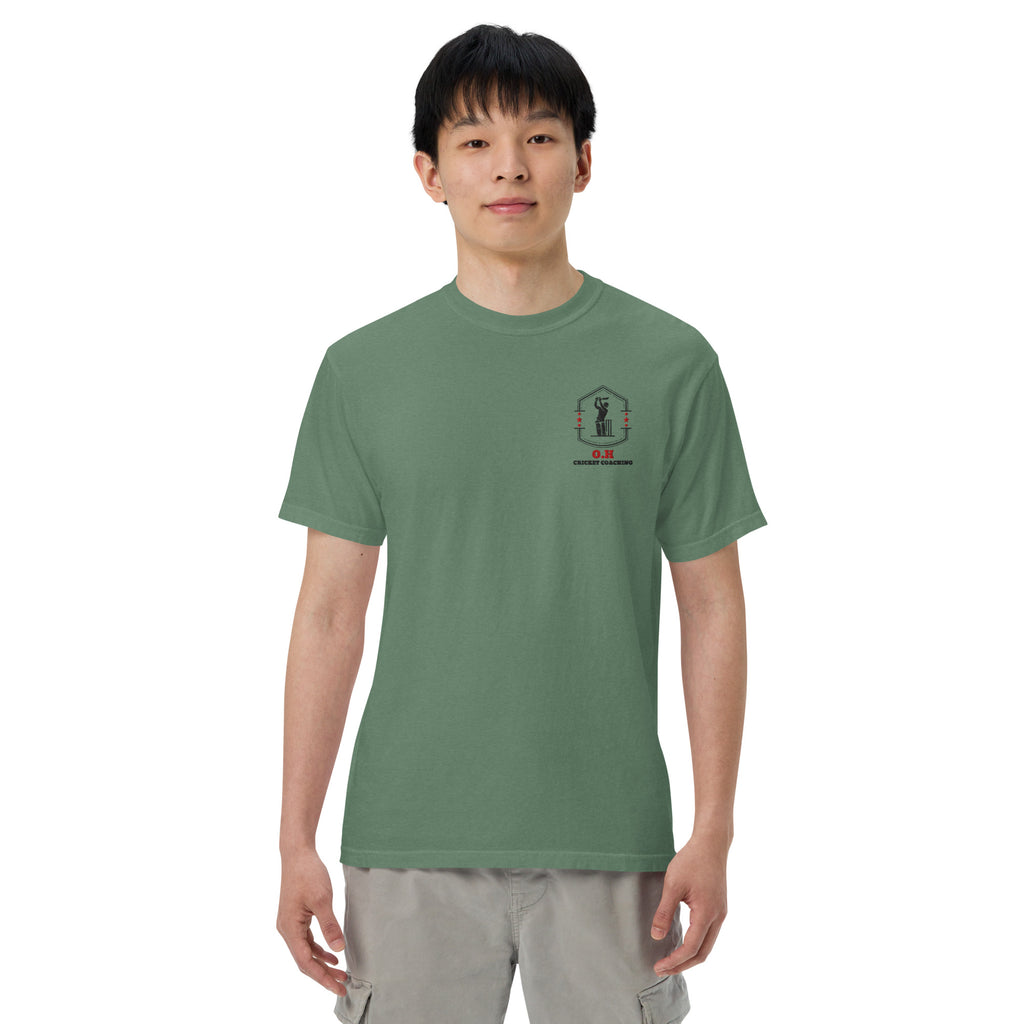 Person wearing a green t-shirt with a logo on a white background