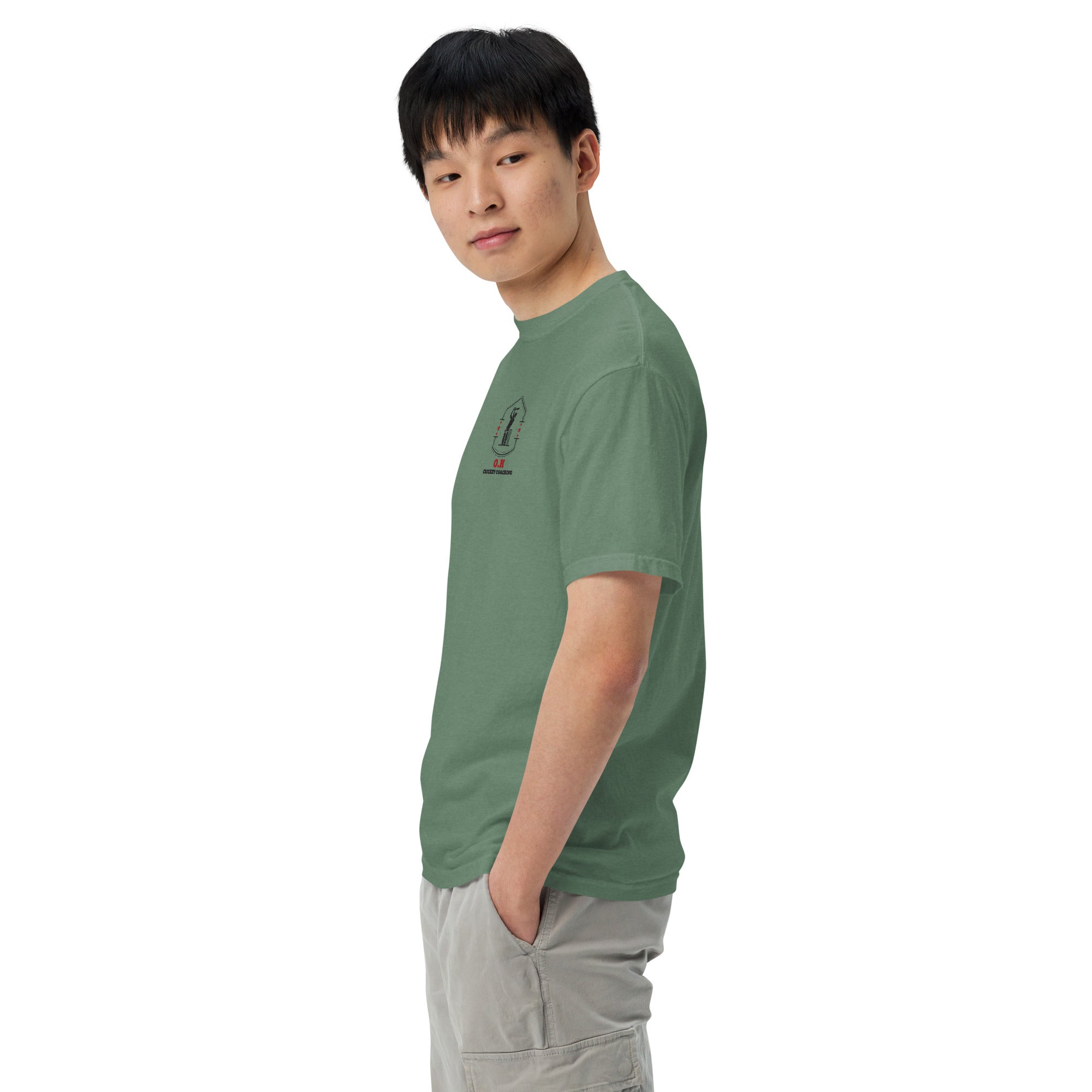 Person wearing a green t-shirt with text on a white background