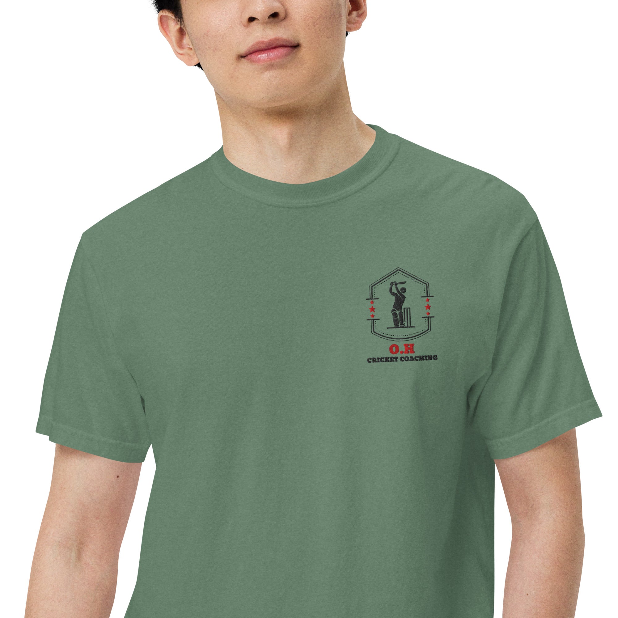 Man wearing light green t-shirt with the OH cricket coaching logo