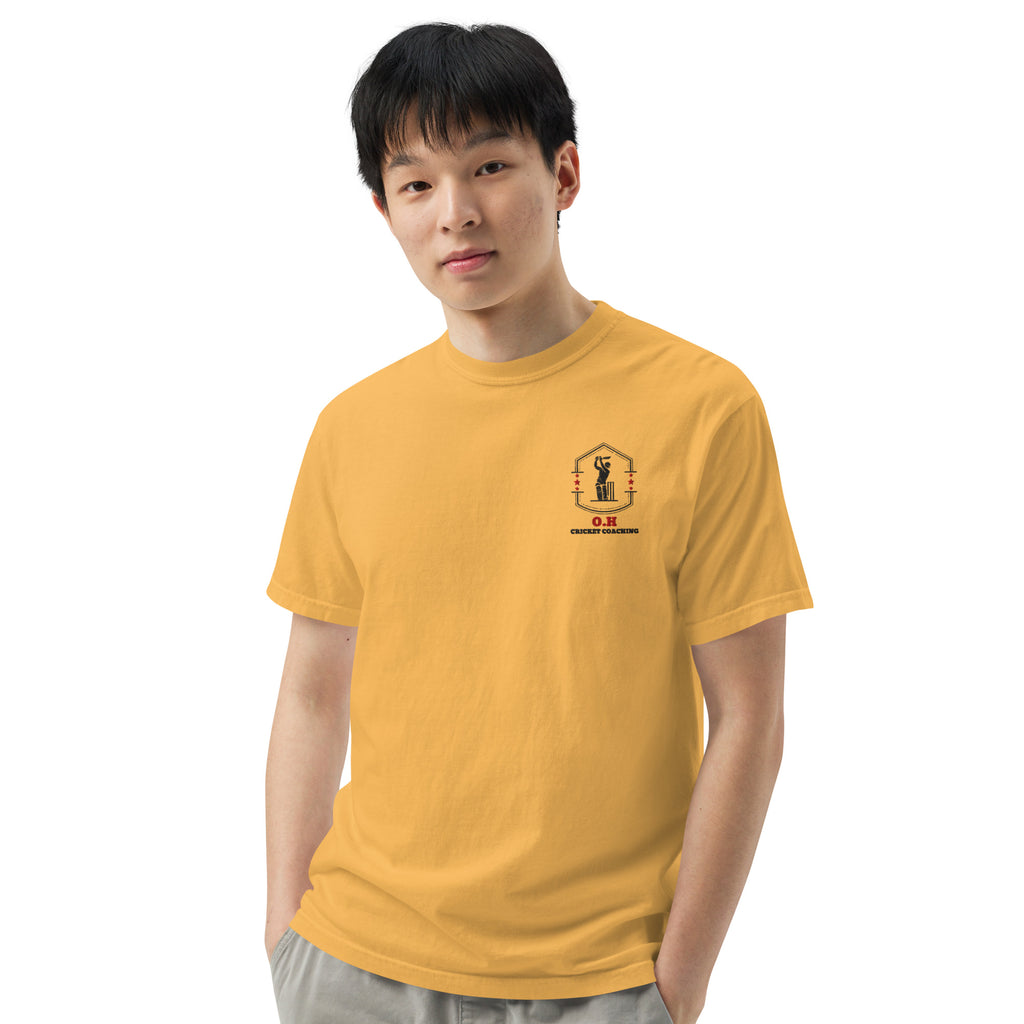 Person wearing a yellow t-shirt with a logo on a white background