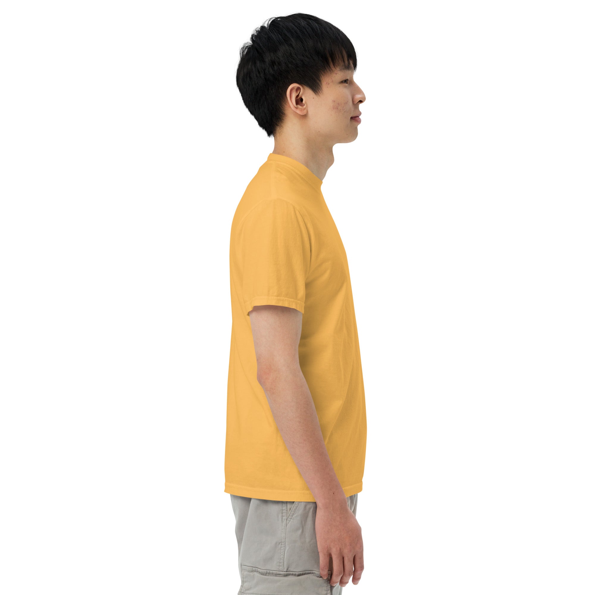 Person wearing a yellow t-shirt on a white background