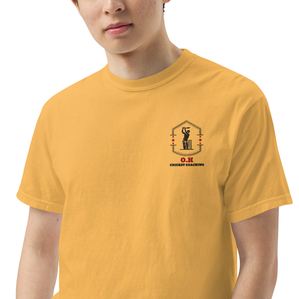 Person wearing a yellow t-shirt with a logo and text on a white background