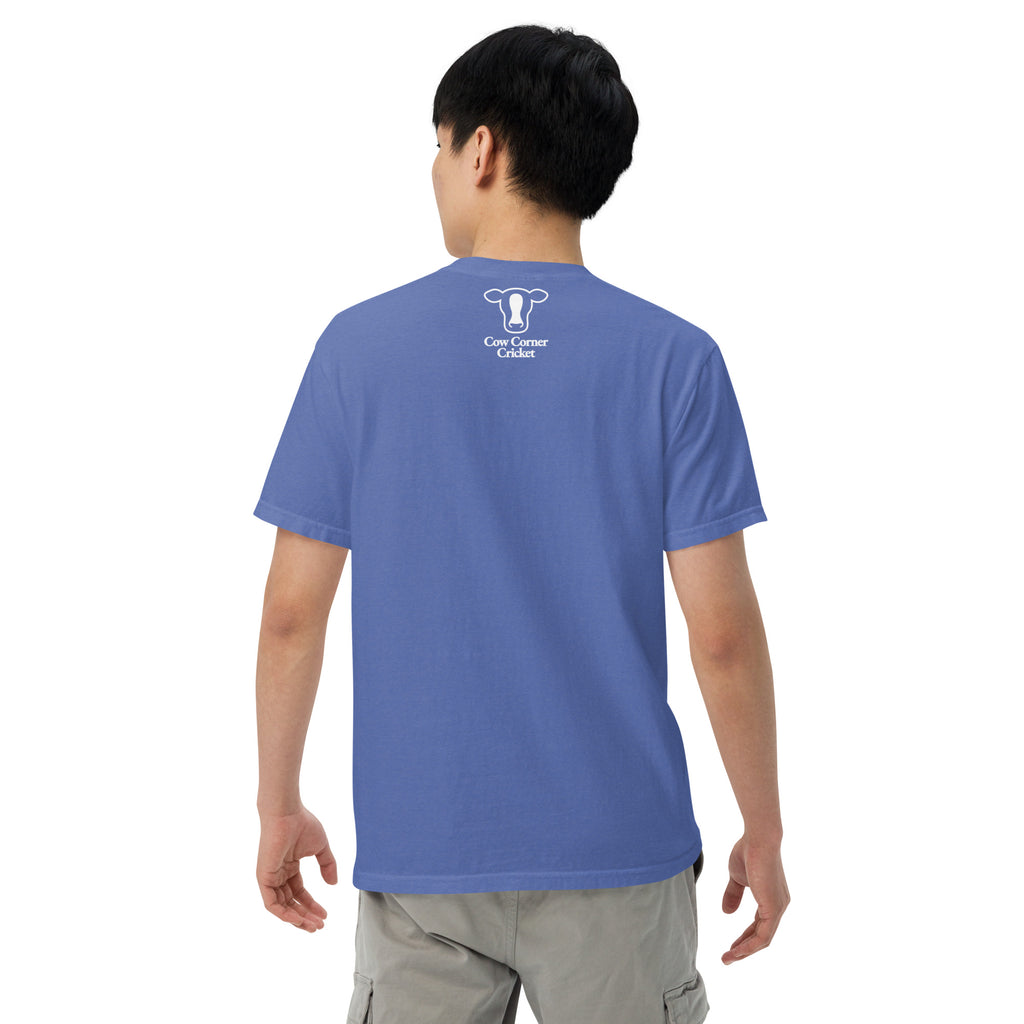 Person wearing a blue t-shirt with 'Bat Ear Society' text on the back