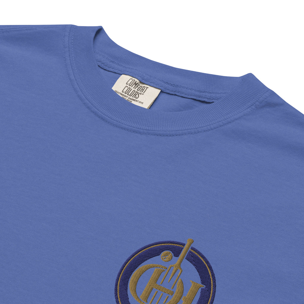 Blue crewneck t-shirt with a gold and navy circular graphic logo on the chest.
